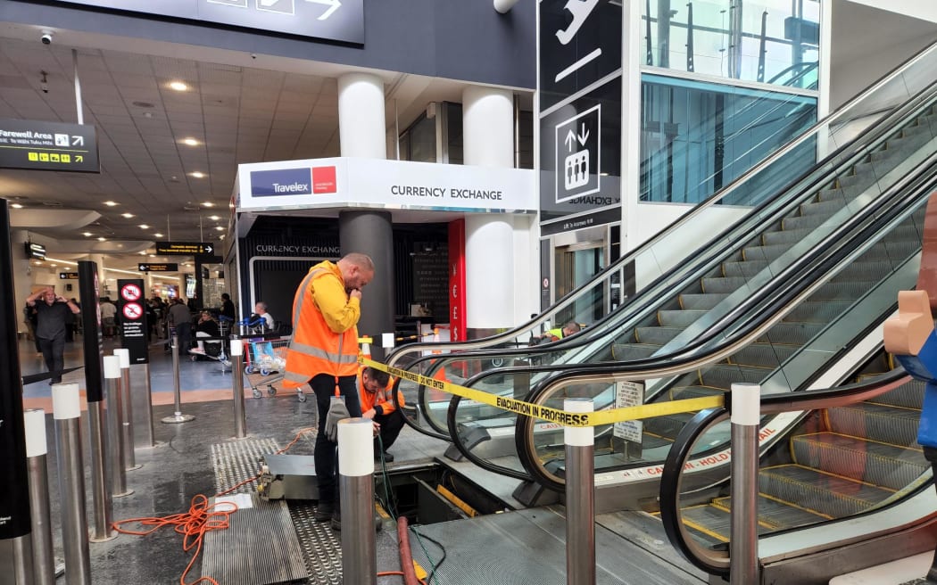 The escalator being fixed at Auckland International Airport