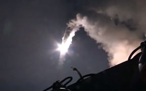 An image grab from a video released by the Russian Defence Ministry shows a Russian warship launching a cruise missile in the Caspian Sea during a strike against Islamic State (IS) in Syria.