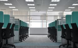 Empty office desks and chairs