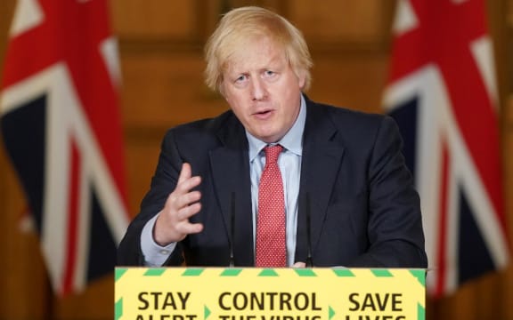 A handout image released by 10 Downing Street, shows Britain's Prime Minister Boris Johnson attending a remote press conference to update the nation on the COVID-19 pandemic.