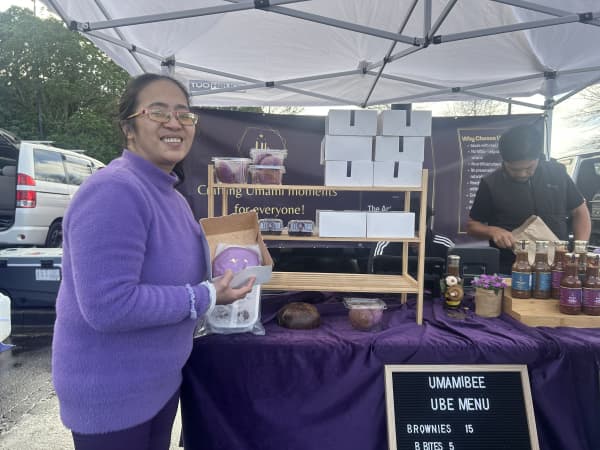 Analiza Badilles poses with her ube products.