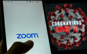 Logo of Zoom, video conferencing application services company is seen with the text of coronavirus COVID-19 in the back of it in Yogyakarta, Indonesia on April 3, 2020. Zoom video conferencing application is used to have a group chat from their separate homes, due to the coronavirus COVID-19.
