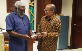 Vanuatu's Prime Minister Joe Natuman and Indonesian Ambassador Nadjib Riphat Kesoema.