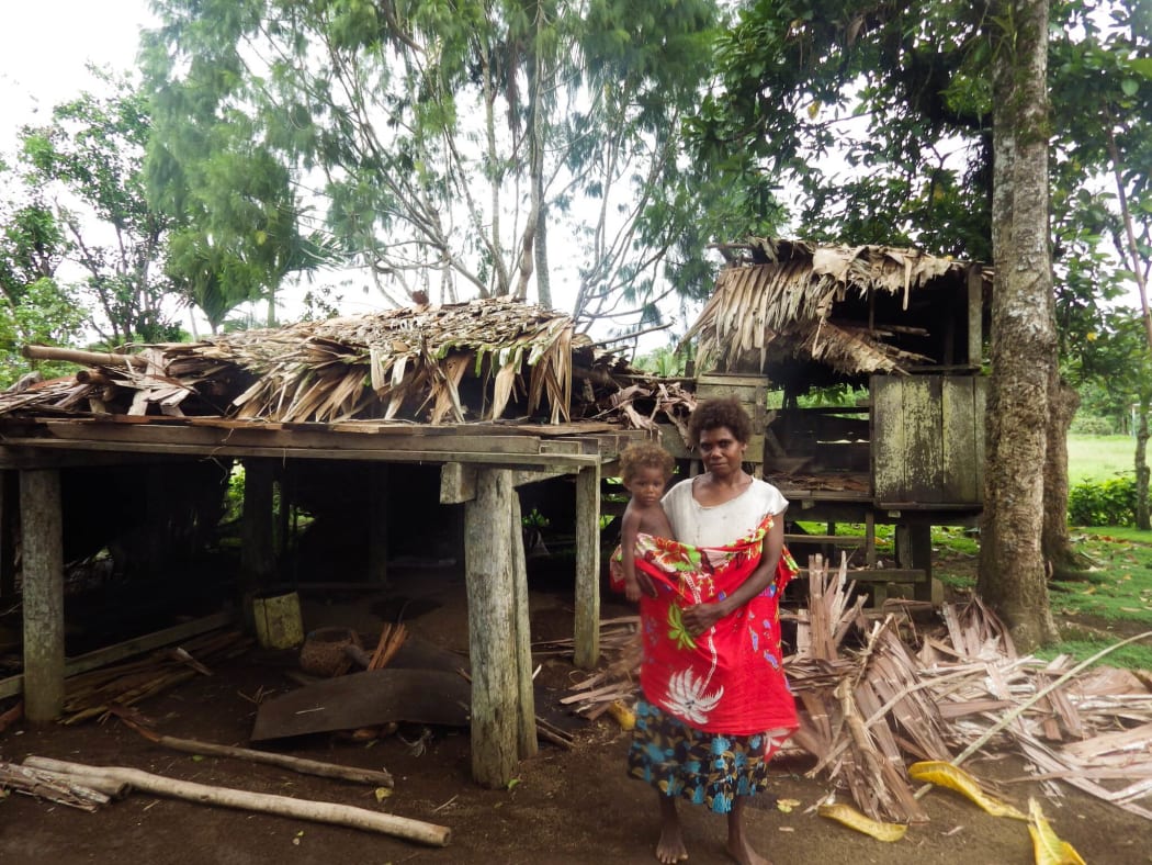 This mother from Manitawaniuhi Village cooking breakfast for her kids when the roof of their fell on top of her and a child she was carrying.