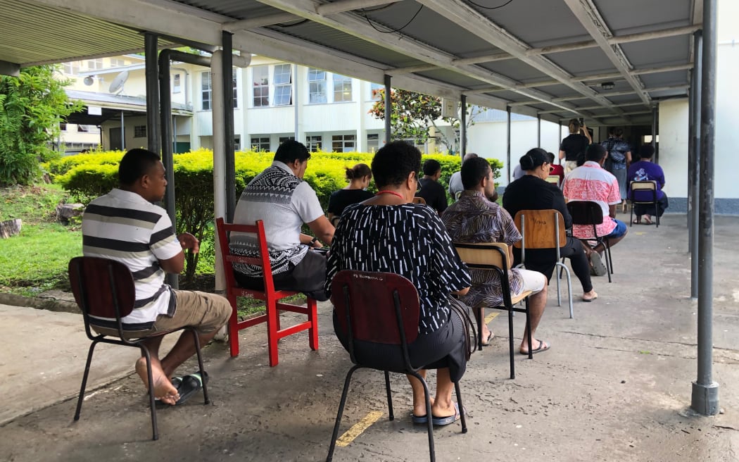 Early birds - Voters in Fiji waiting for the polling station at Suva Grammar to open this morning. 14 December 2022.