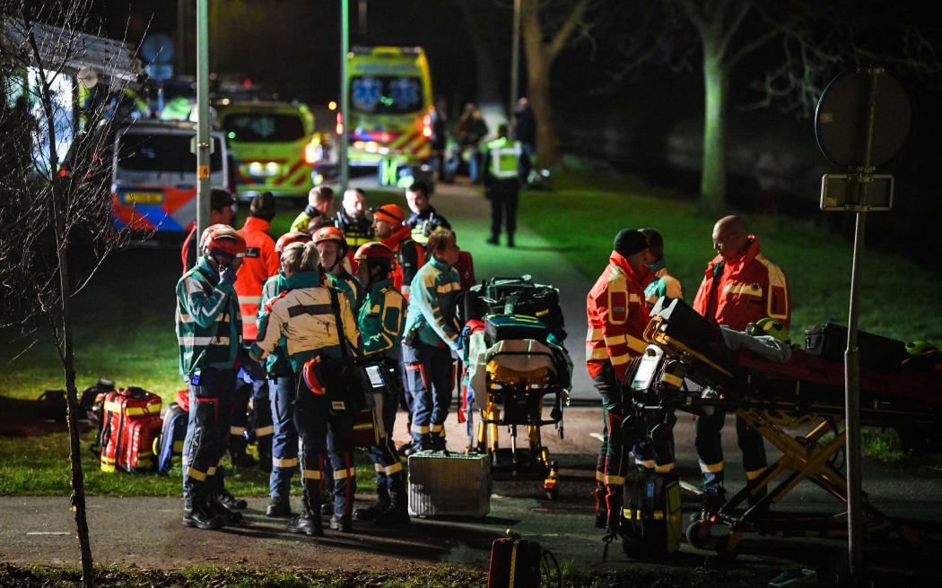Voorschoten - Emergency services on their way to a derailed train. Several people were seriously injured in a collision between a passenger train and a freight train. ANP JOSH WALET netherlands out - belgium out (Photo by Josh Walet / ANP MAG / ANP via AFP)