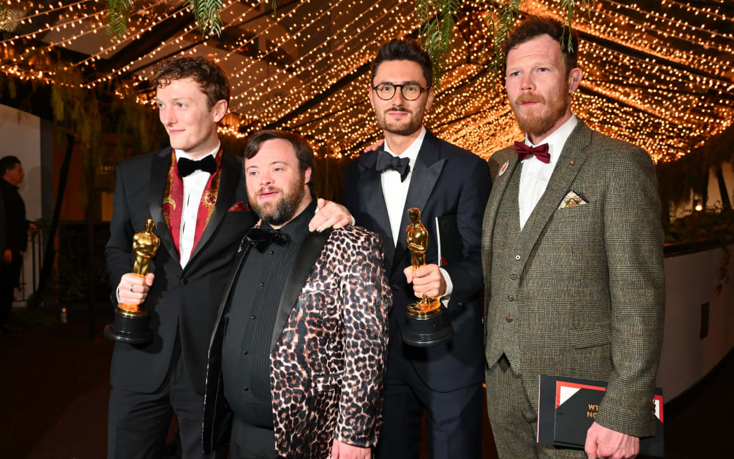 (From left) Filmmakers Ross White, James Martin, Tom Berkeley and Seamus O'Hara, winners of the Oscar for Best Live Action Short Film for "An Irish Goodbye", attends the 95th Annual Academy Awards Governors Ball in Hollywood, California on March 12, 2023. (Photo by ANGELA WEISS / AFP)