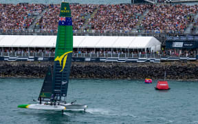 Australia SailGP Team helmed by Tom Slingsby head towards the finish marker in front of a sold out grandstand of spectators to win the final race on Race Day 2 of The Rolex SailGP 2025 Championship ITM New Zealand Sail Grand Prix in Auckland, New Zealand. Sunday 19 January 2025. Photo: Bob Martin for SailGP. Handout image supplied by SailGP