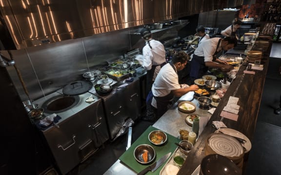 Kitchen staff in Cassia Restaurant on Fort Lane, Auckland City.