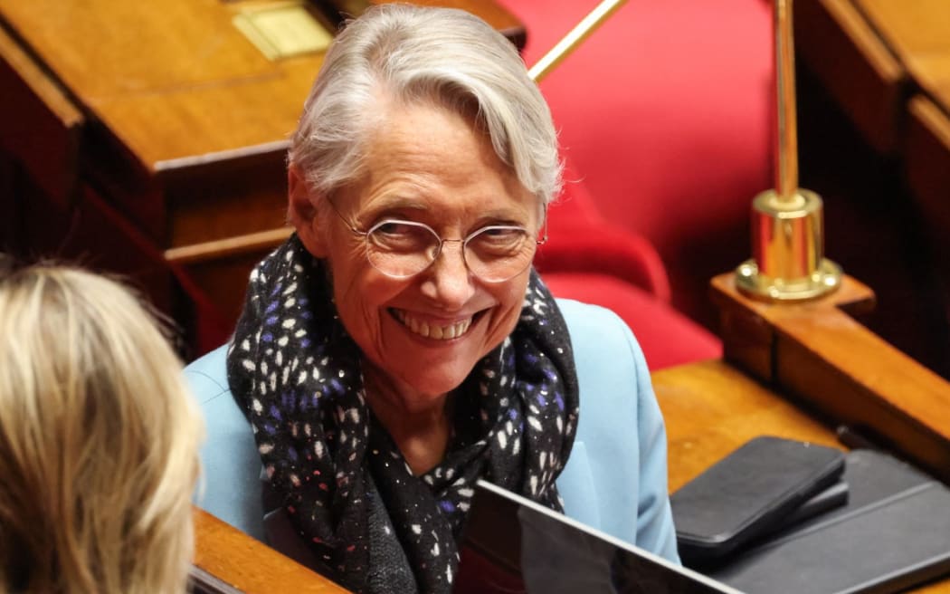 Ensemble Pour la Republique's MP Elisabeth Borne smiles during a parliamentary debate on legislative process for a social media ban on under-15s at the Assemblee Nationale, France's lower house Parliament in Paris on January 26, 2026.