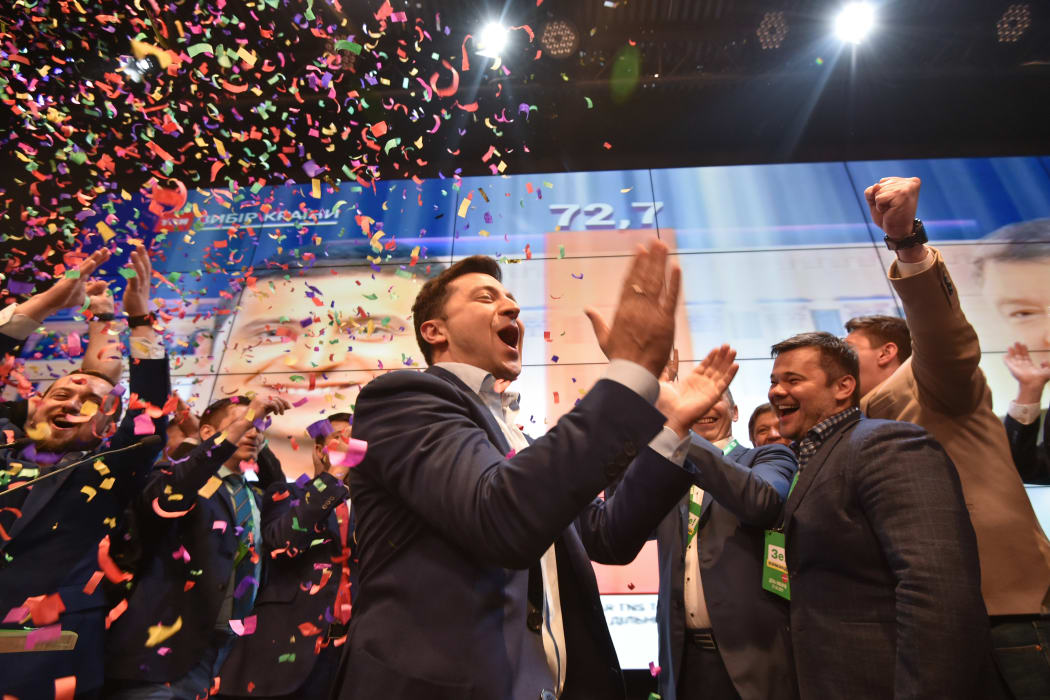 Ukrainian comedian and presidential candidate Volodymyr Zelensky reacts after the announcement of the first exit poll results in the second round of Ukraine's presidential election at his campaign headquarters in Kiev on April 21, 2019. (Photo by Genya SAVILOV / AFP)