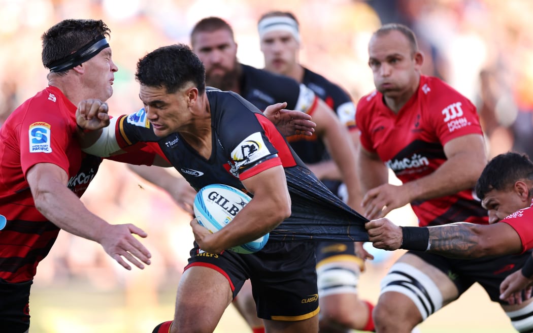 Quinn Tupaea of the Chiefs is tackled.