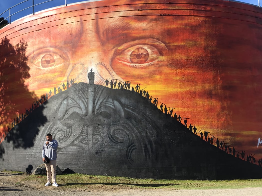 Artist Mr G painted Maia's face on a Water tank situated on Mount Maunganui, 2017.