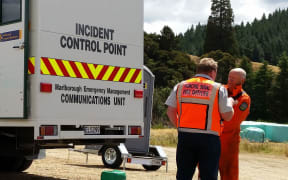 Richard McNamara and Rich Law, from the Blenheim rural fire force, in front of the incident control point.