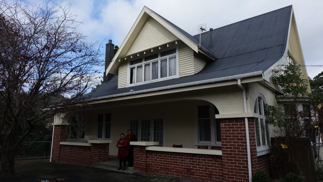 Social workers Charmaine McClean-Whaanga and Rau Sparrow stand outside the new emergency house in Naenae.