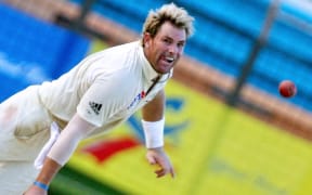 In this file photograph taken on April 19, 2006, Australian cricketer Shane Warne delivers a ball during the fourth day of the second Test match between Bangladesh and Australia at The Chittagong Divisional Stadium in Chittagong.