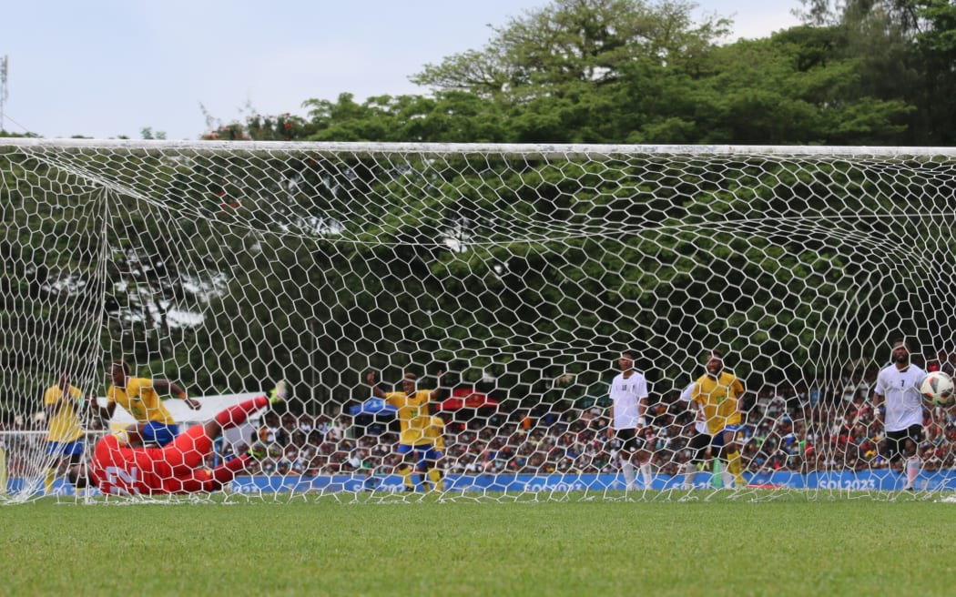 Pacific Games football semi-finals: Penalty! - Solomon Islands talismanic striker Raphael Leai sends Fiji’s goalkeeper and captain Akuila Mataisuva the wrong way from the spot to open the scoring for the hosts who went on to win 2-0 setting up a grand final with their arch nemesis New Caledonia on Saturday. Lawson Tama Stadium, Honiara 28 November 2023. Credit RNZ Pacific/Koroi Hawkins