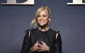 Reese Witherspoon speaks on stage during ELLE's 24th Annual Women in Hollywood Celebration.