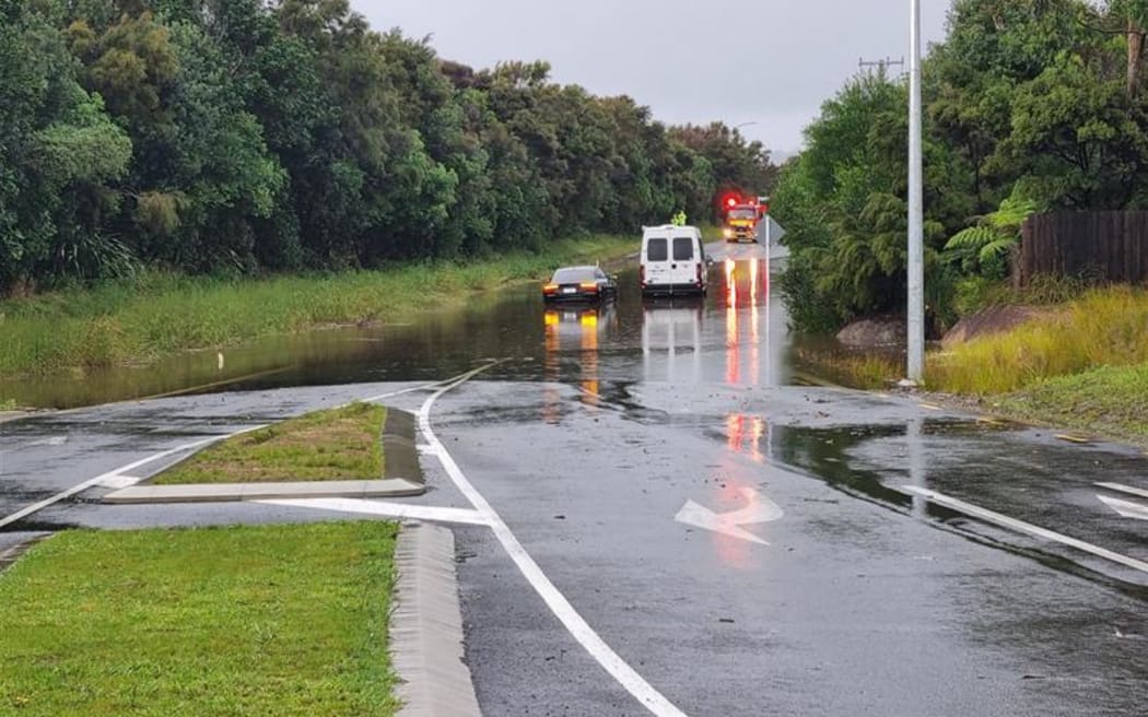 The scene of flooding in Mangawhai where a car got stuck after surface flooding.