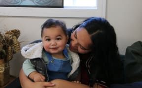 Katrina Kepa and her 10-month-old son Jazahrn at the opening of Te Whare Piringa, a new iwi-led kaupapa Māori space offering dedicated support to mātua taiohi (young parents) and whānau.