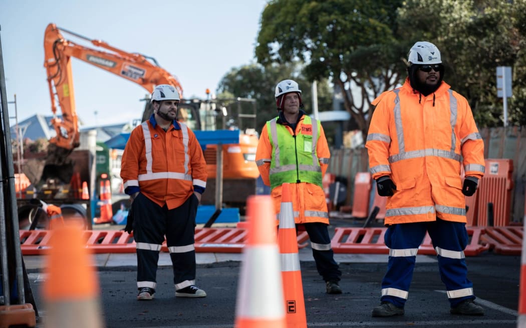 Workers at the College Hill Road sinkhole.