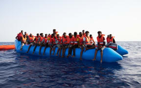 An overloaded rubber boat in international waters off the Libyan coast earlier this month.