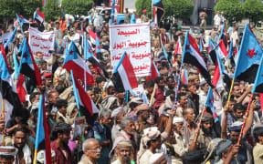 Yemenis members of the Sabahiha tribes of Lahj, gather during a rally to show their support for the UAE-backed Southern Transitional Council (STC). The council wants to revive an independent South Yemen, as they wave the old South Yemen flag in Khormaksar Square, on December 14, 2025.