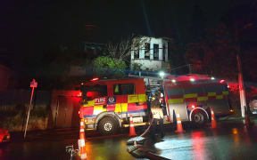 A fire truck outside a house on Hanson St, Newtown, gutted by fire.