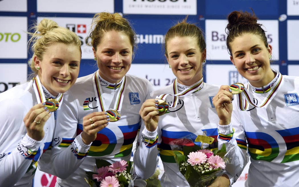 Members of the Australia's team, (from L) Annette Edmondson, Ashlee Ankudinoff, Amy Cure and Melissa Hoskins celebrate on the podium after winning the Women's Team pursuit Final at the UCI Track Cycling World Championships in Saint-Quentin-en-Yvelines, near Paris, on February 19, 2015.  AFP PHOTO / ERIC FEFERBERG (Photo by ERIC FEFERBERG / AFP)