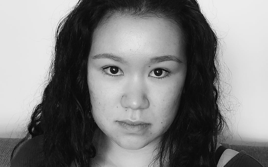 Black and white full-frame photo of Dunedin youth writer Shima Jack