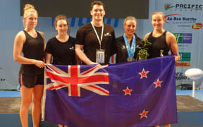 The NZ team celebrates Amanda Gould's three silver medals
