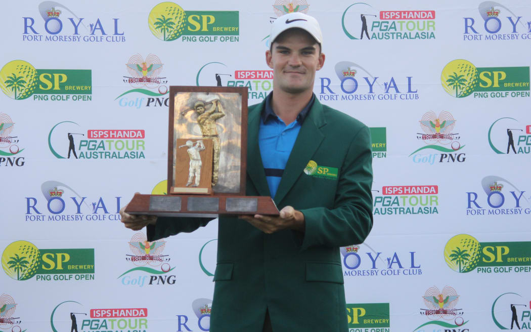 Cory Crawford celebrates winning the PNG Open.