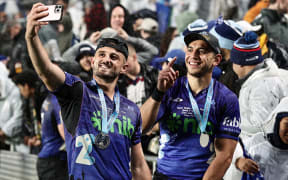 Blues players Harry Plummer and Bryce Heem (R) meet supporters after victory in the Super Rugby Pacific Final. 2024.