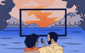 Couple sitting watching tv