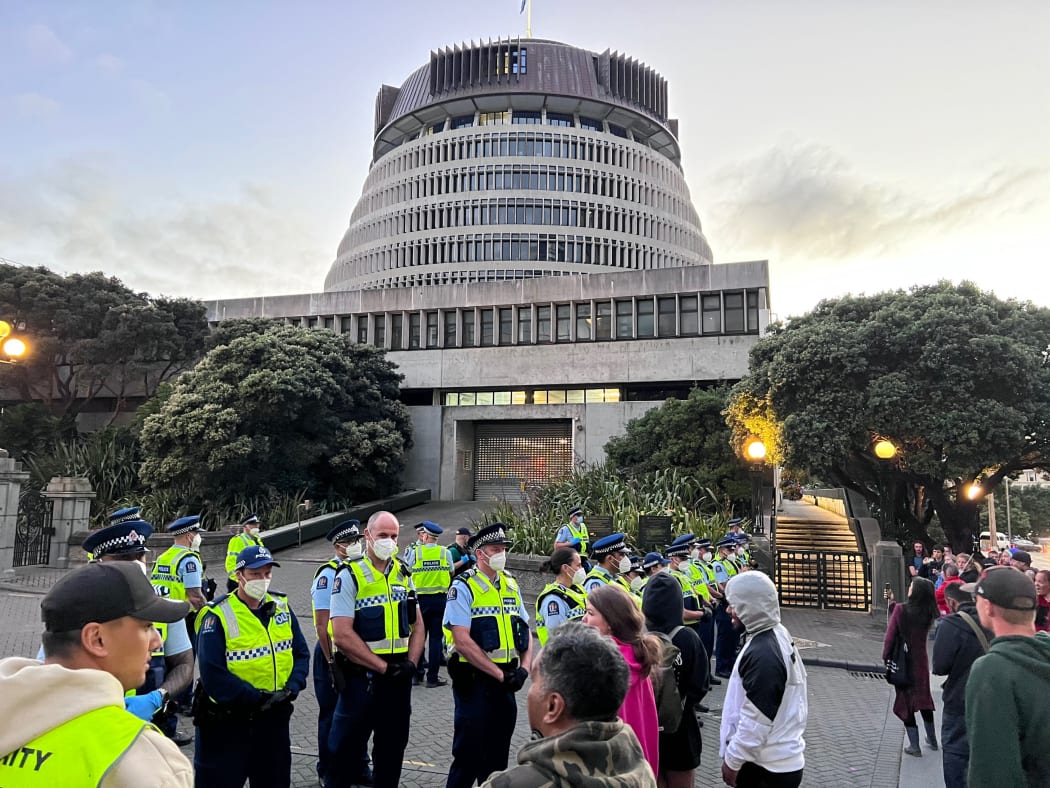 Police and protesters at Parliament on 21 February 2022.