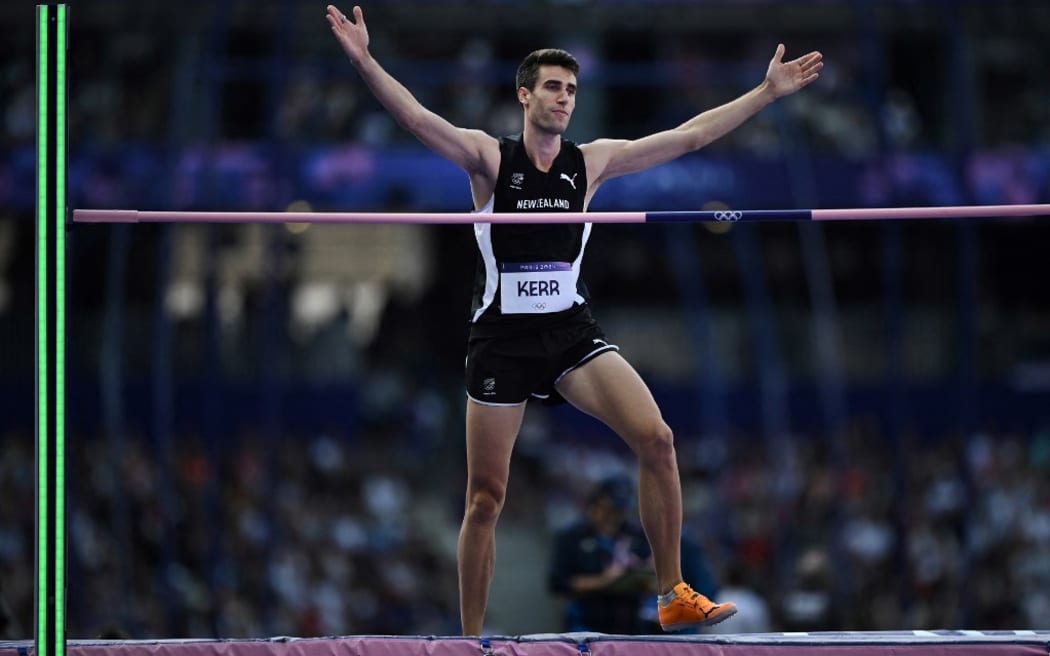 New Zealand's Hamish Kerr reacts as he competes in the men's high jump qualification of the athletics event at the Paris 2024 Olympic Games at Stade de France in Saint-Denis, north of Paris, on August 7, 2024. (Photo by Ben STANSALL / AFP)