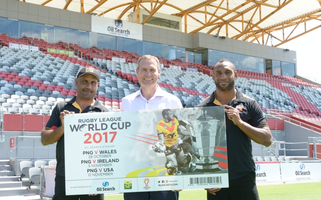 PNG coach Michael Marum, Rugby League World Cup CEO Andrew Hill and Kumuls fullback Stargroth Amean promote cheap ticket prices in Port Moresby.