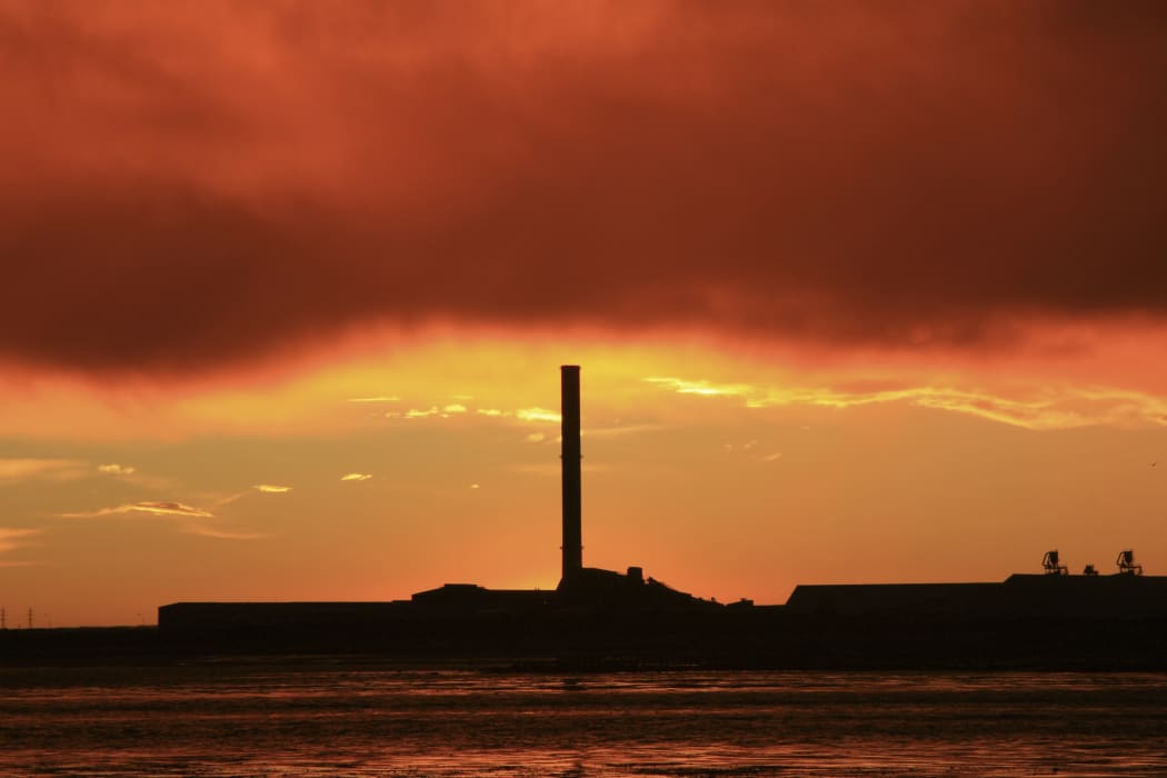 21586193 - a vibrant sunrise overlooking bluff aluminium smelter new zealand