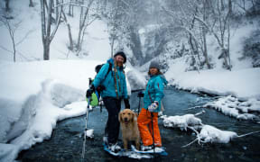 Mike and Akie Harris with their dog Scooby