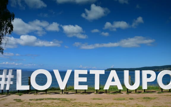 "#LOVETAUPO" sign next to Lake Taupo.