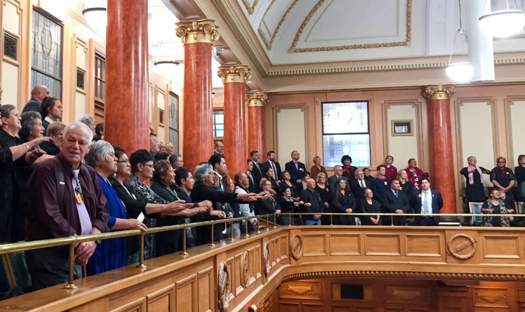 Whanganui iwi sing waiata after the passing of the third and final reading of te Awa Tupua, (Whanganui River Claims Settlement), Bill.