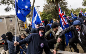 Protestors wear face masks during a 'Say No To Racism' protest in Coburg, Melbourne last year.