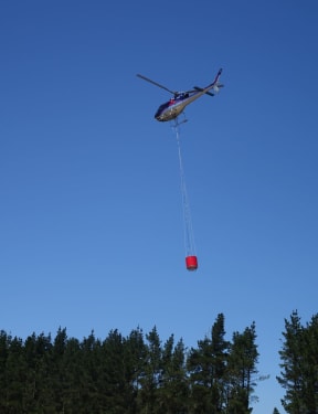 A monsoon bucket being used in the blaze near Rolleston.