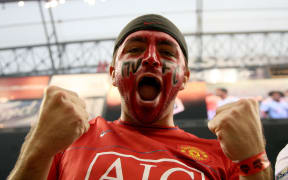 A Manchester United fan celebrates during the game of the MLS All-Stars against Manchester United FC in the 2010 MLS All-Star game in Houston, Texas.