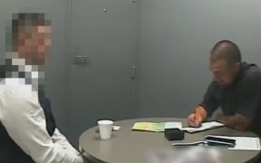 An image taken from video shown to the jury of defendant being interviewed by a police officer at Auckland Central Police Station on 6 December.