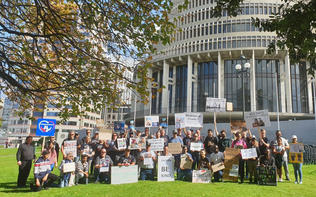 Migrant family protest outside Parliament.