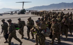 BAGRAM AIR BASE, AFGHANISTAN - MAY 11: U.S. Army soldiers from the 101st Airborne Division march from the back of a C-17 cargo plane May 11, 2013 at Bagram Air Base, Afghanistan.