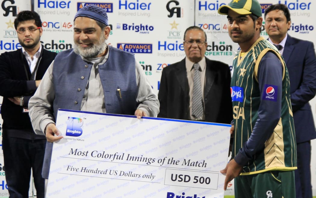 Pakistan allrounder Haris Sohail receives a prize for the most colourful innings during a one day match against New Zealand last year.