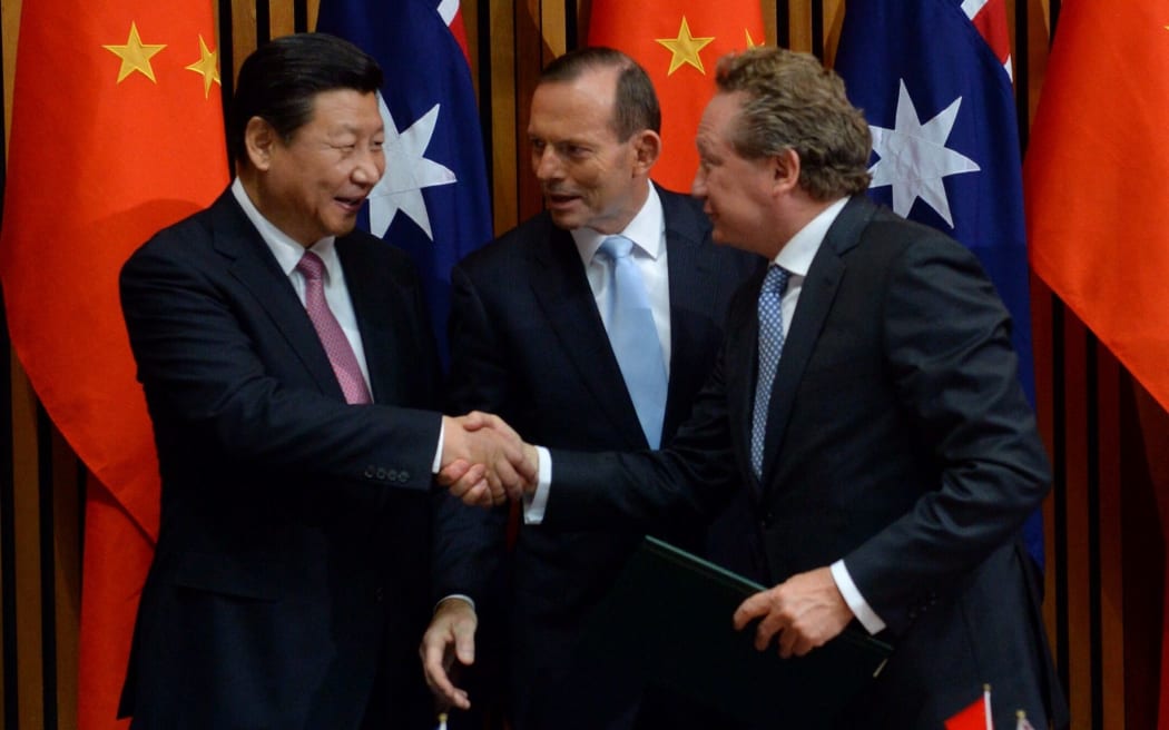 President of China Xi Jinping, Australian Prime Minister Tony Abbott and Fortescue Metals CEO Andrew Forrest after the signing of a framework for the free trade agreement in Canberra on Monday.