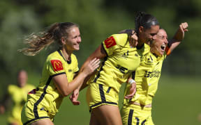WELLINGTON, NEW ZEALAND - JANUARY 04: Grace Jale celebrates with Lara Wall (L) and Annalie Longo after scoring a goal during the round 10 A-League Women's match between Wellington Phoenix and Perth Glory at Porirua Park, on January 04, 2025, in Wellington, New Zealand. (Photo by Hagen Hopkins/Getty Images)